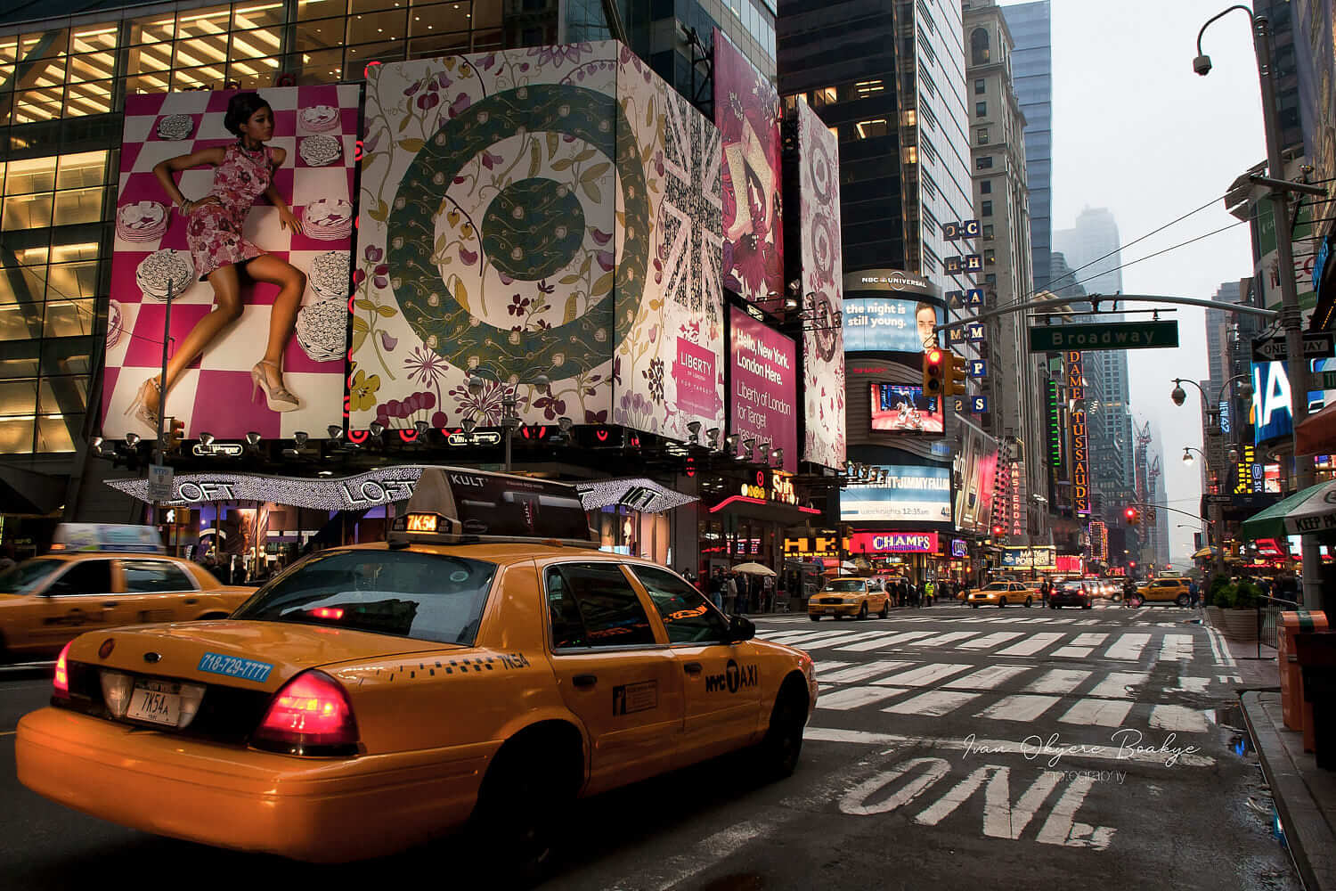 Yellow cabs and huge colourful advertising billboards in the hectic and fun Broadway area of New York, USA