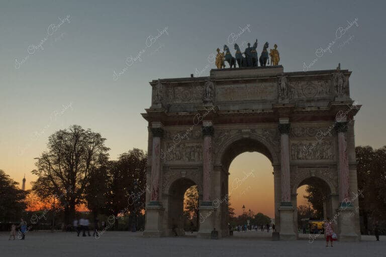 The Arc de Triomphe du Carrousel at sunset in Paris, France