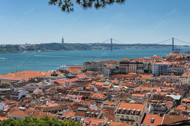 View of Cristo Rei statue and Ponte 25 de Abril in Alfama, Lisbon, Portugal