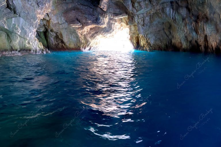 The electric blue colored waters of Blue Cave, Boka Bay, Montenegro