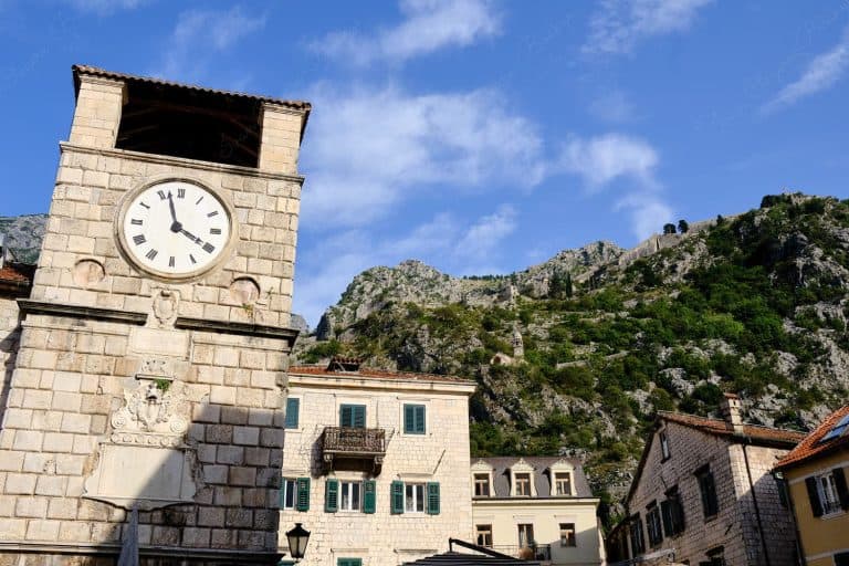 The Clock Tower of Kotor with the Ladder of Kotor trail in the background, Kotor, Montenegro