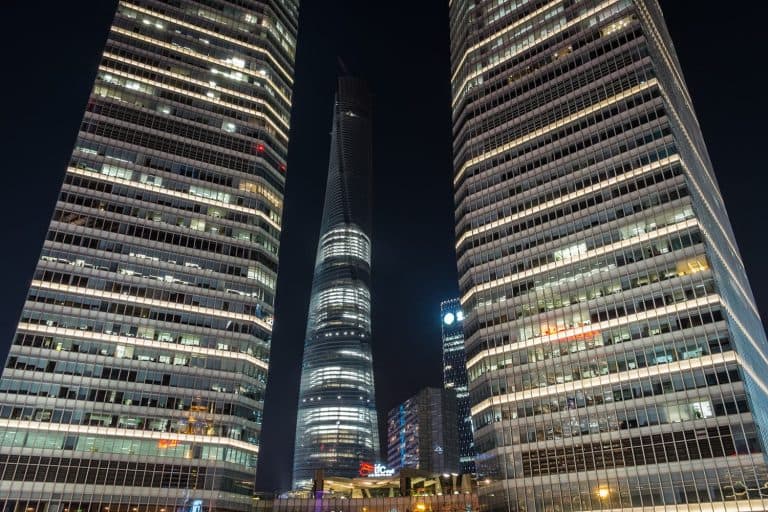 Illuminated Shanghai Tower between 2 skyscrapers, Shanghai, China