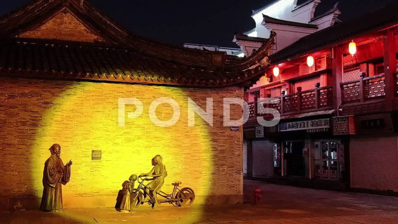 Illuminated Chinese Man Woman And Girl Street Art, Ningbo, China Illuminated Chinese Man Woman And Girl Street Art, Ningbo, China