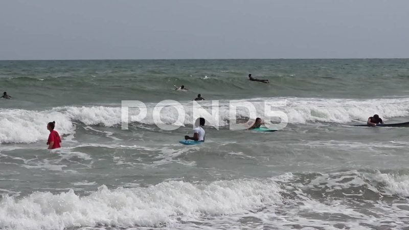 Tourists And Local Ghanaian People Surfing At Kokrobite Beach, Ghana
