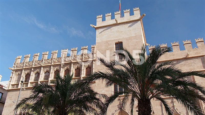 La Lonja Or The Silk Exchange Through Palm Trees, Valencia, Spain La Lonja Or The Silk Exchange Through Palm Trees, Valencia, Spain