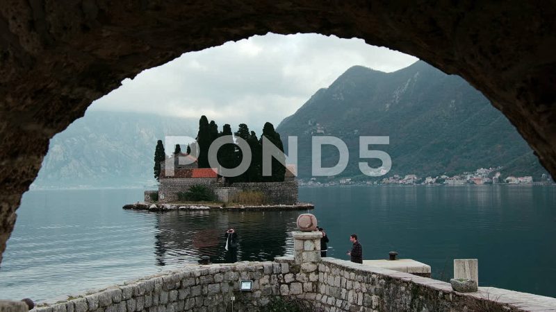 Arch Framed View Of Saint George Catholic Monastery, Perast, Montenegro Arch Framed View Of Saint George Catholic Monastery, Perast, Montenegro