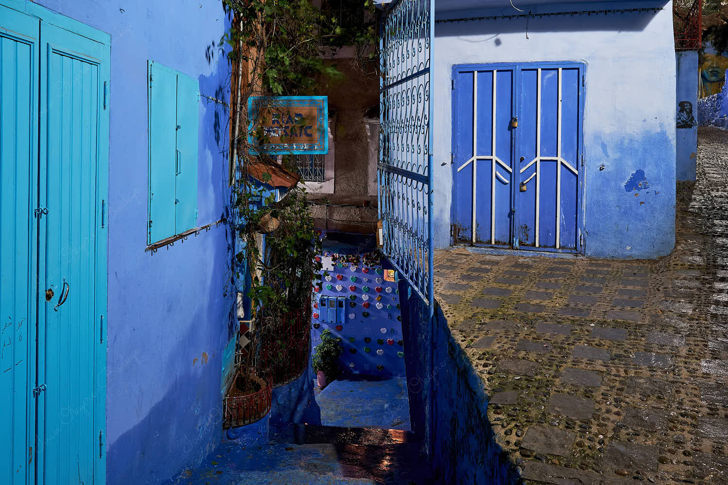 Beautiful illuminated empty street at night in the blue walled old town, Chefchaouen, Morocco