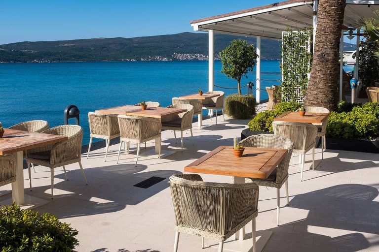 Empty chair and table with outdoor view. Tivat Porto Montenegro - By Renat
