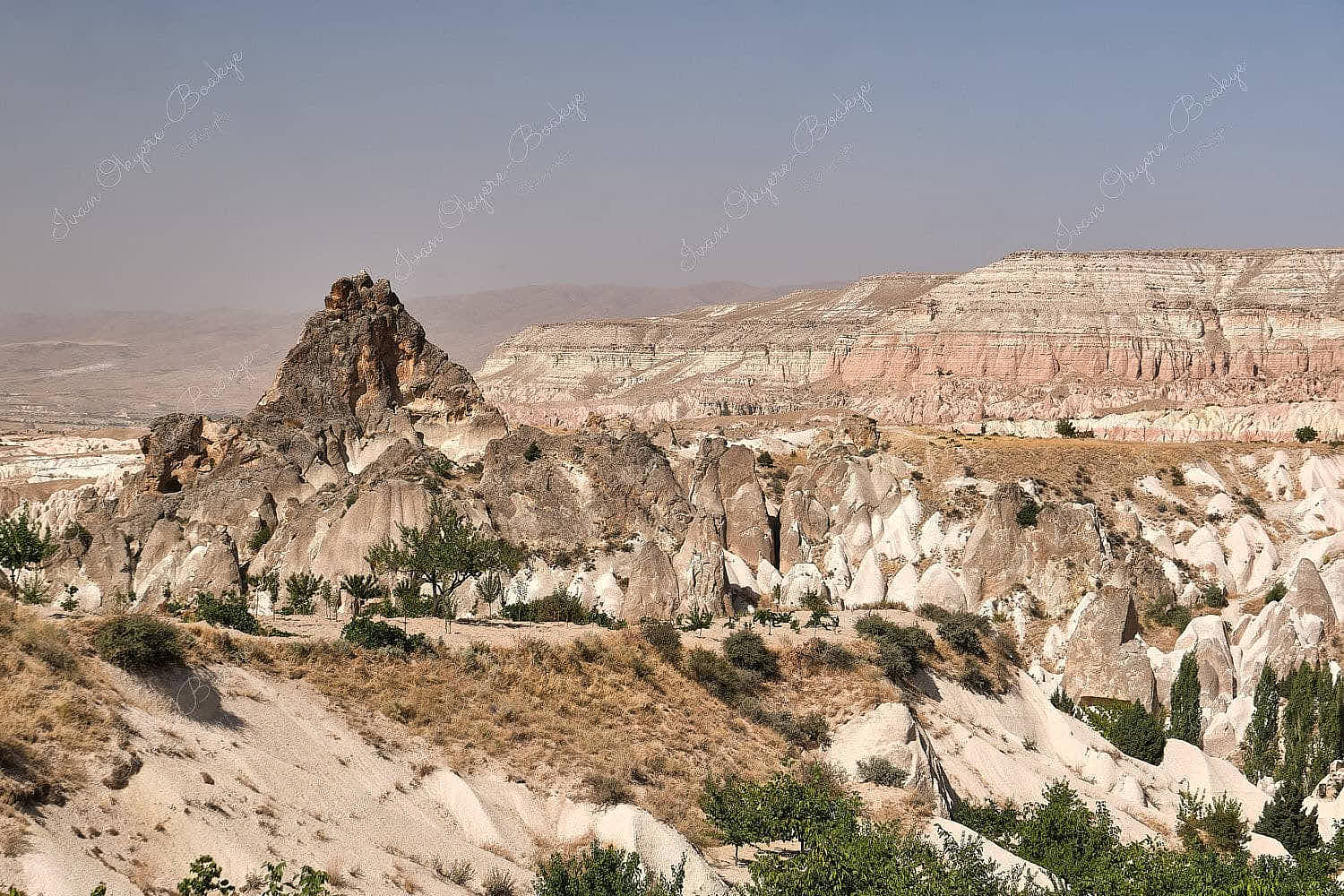 Panoramic view of Cappadocia landscape with striking rock formations and hills, Cappadocia, Turkey
