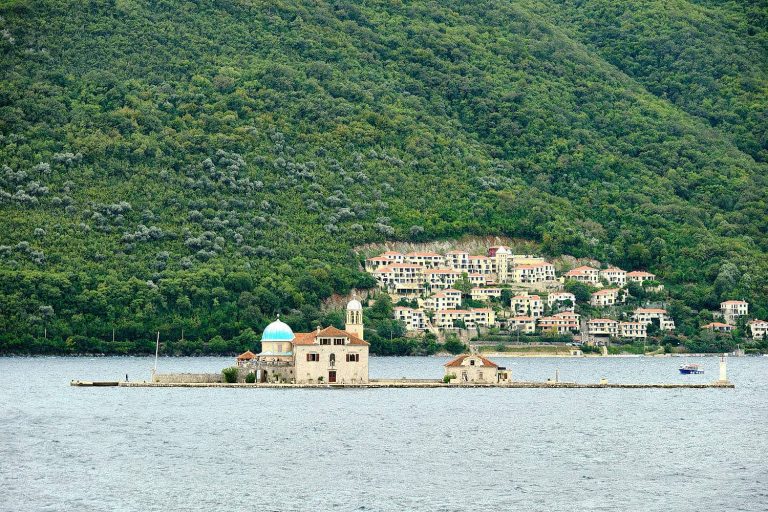 Our Lady of The Rocks with Perast old town in background, Perast, Montenegro