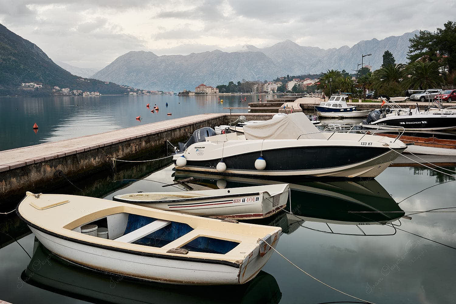 Promenade view of boats at Kotor Bay and mountains, Kotor, Montenegro