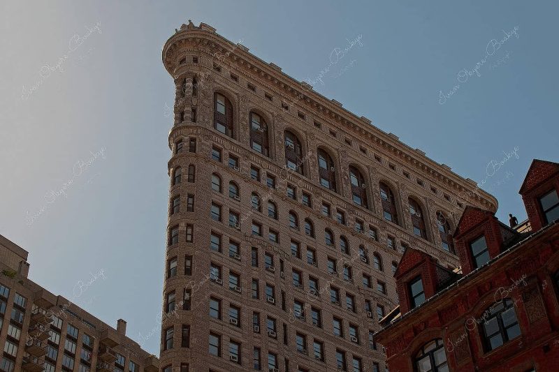 Event Horizon art project with Antony Gormley Naked Man Statue on roof of building next to Flatiron Building, New York, America