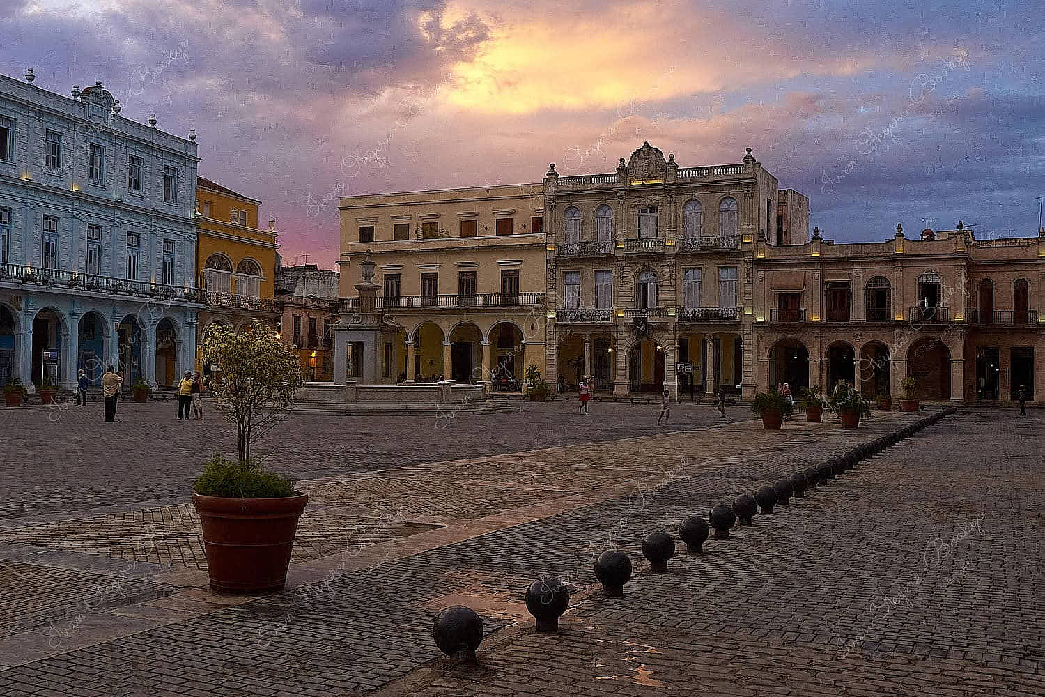 Sunset following a rain shower in the wonderful colourful Plaza Vieja square surrounded by pastel-coloured colonial buildings, Habana Vieja, Cuba