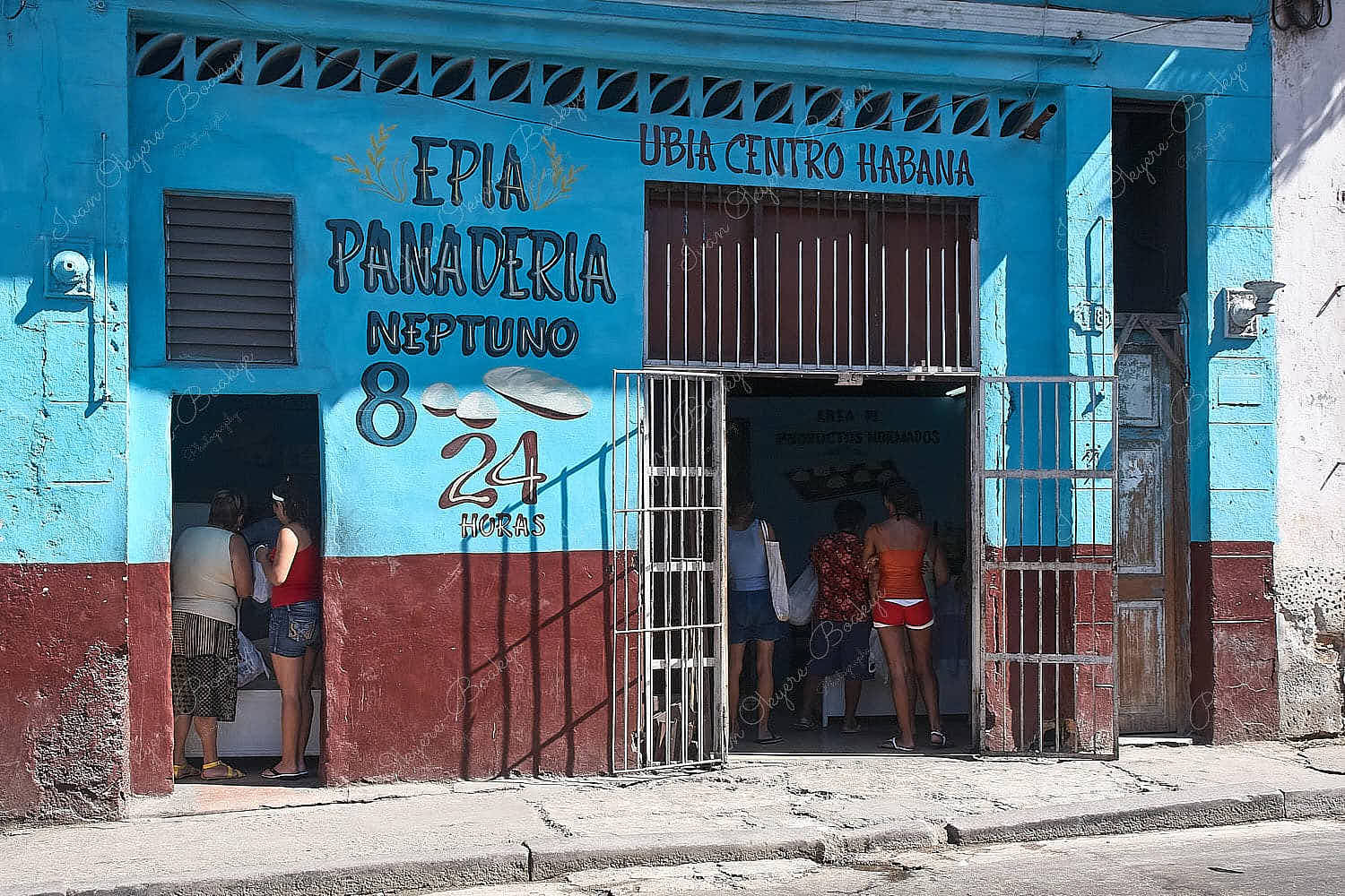 Cuban women shopping for bread in bakery shop in Centro Habana, Cuba