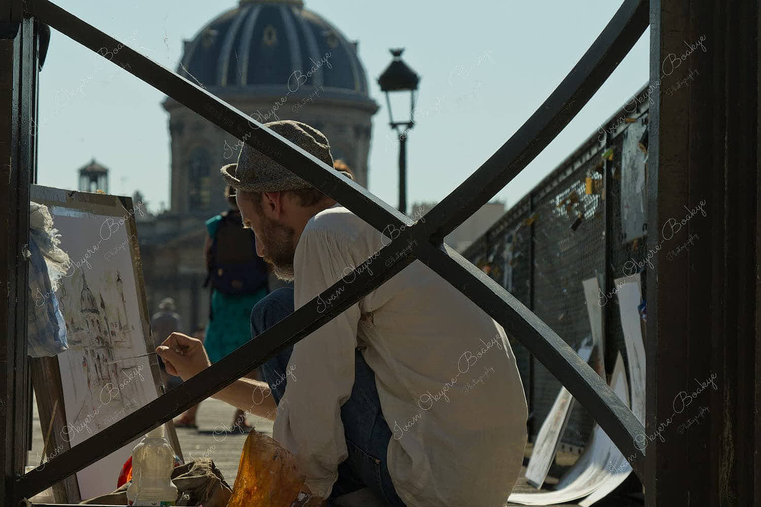 Street Artist on Pont des Arts painting picture of Bureau des Longitudes, Paris, France