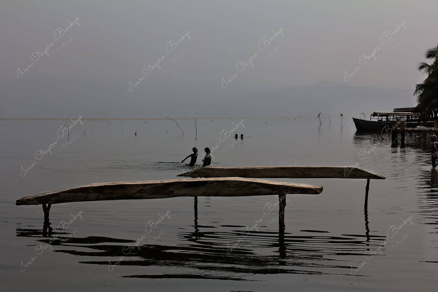 Children playing near Padua (wooden plank for fishing) at Lake Bosumtwi, Ghana