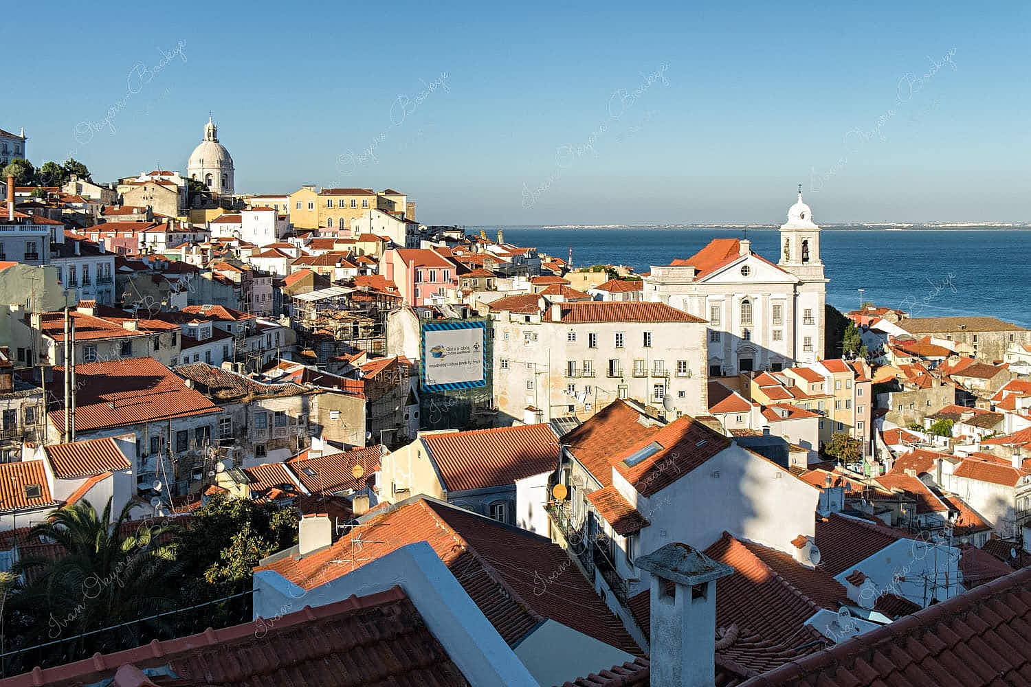 View of Igreja de Santo Estêvão, and Santa Engracia Church from Miradouro das Portas do Sol, Alfama, Lisbon, Portugal