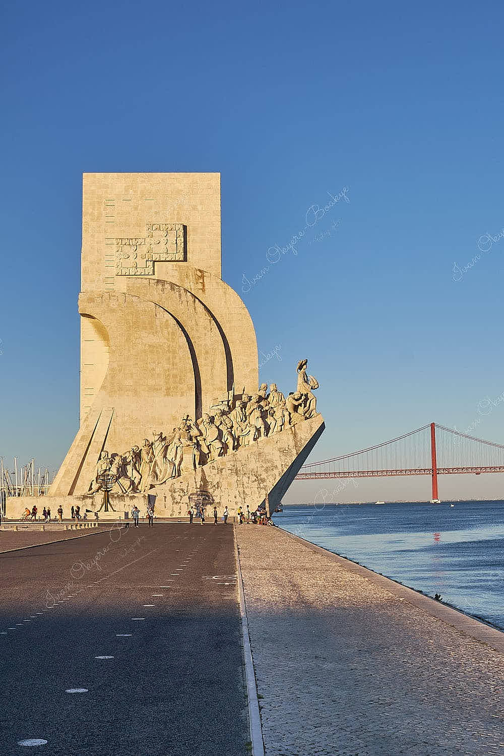 View of Padrão dos Descobrimentos (Monument to the Discoveries) and Ponte 25 de Abrill in Belem, Lisbon, Portugal