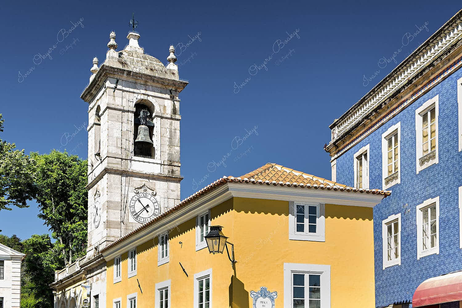 View of Bell Tower rising above colourful walls in Sintra, Lisbon, Portugal