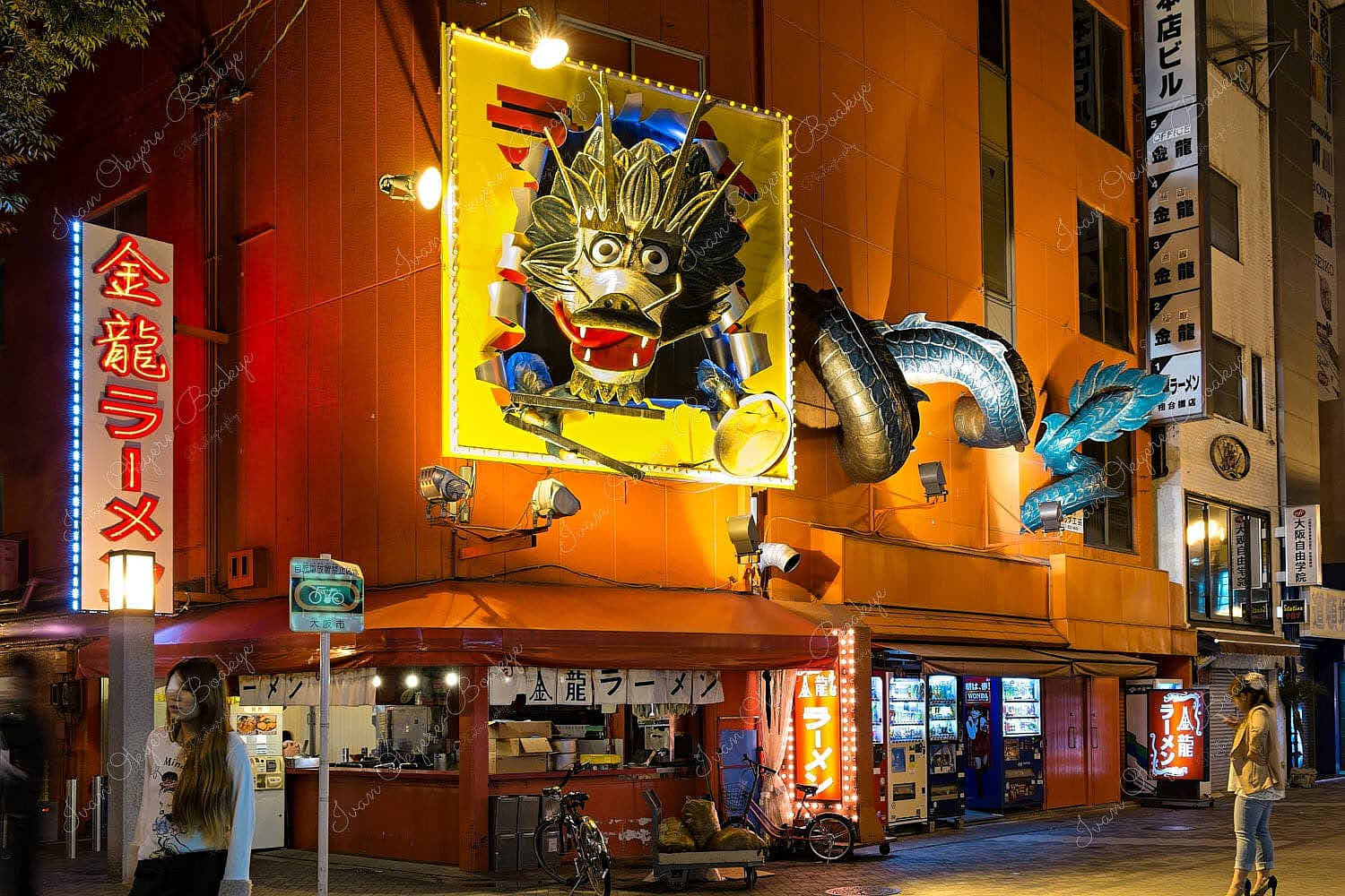 Japanese restaurant with huge dragon signage and neon advertising in Dotonbori, Minami, Osaka, Japan