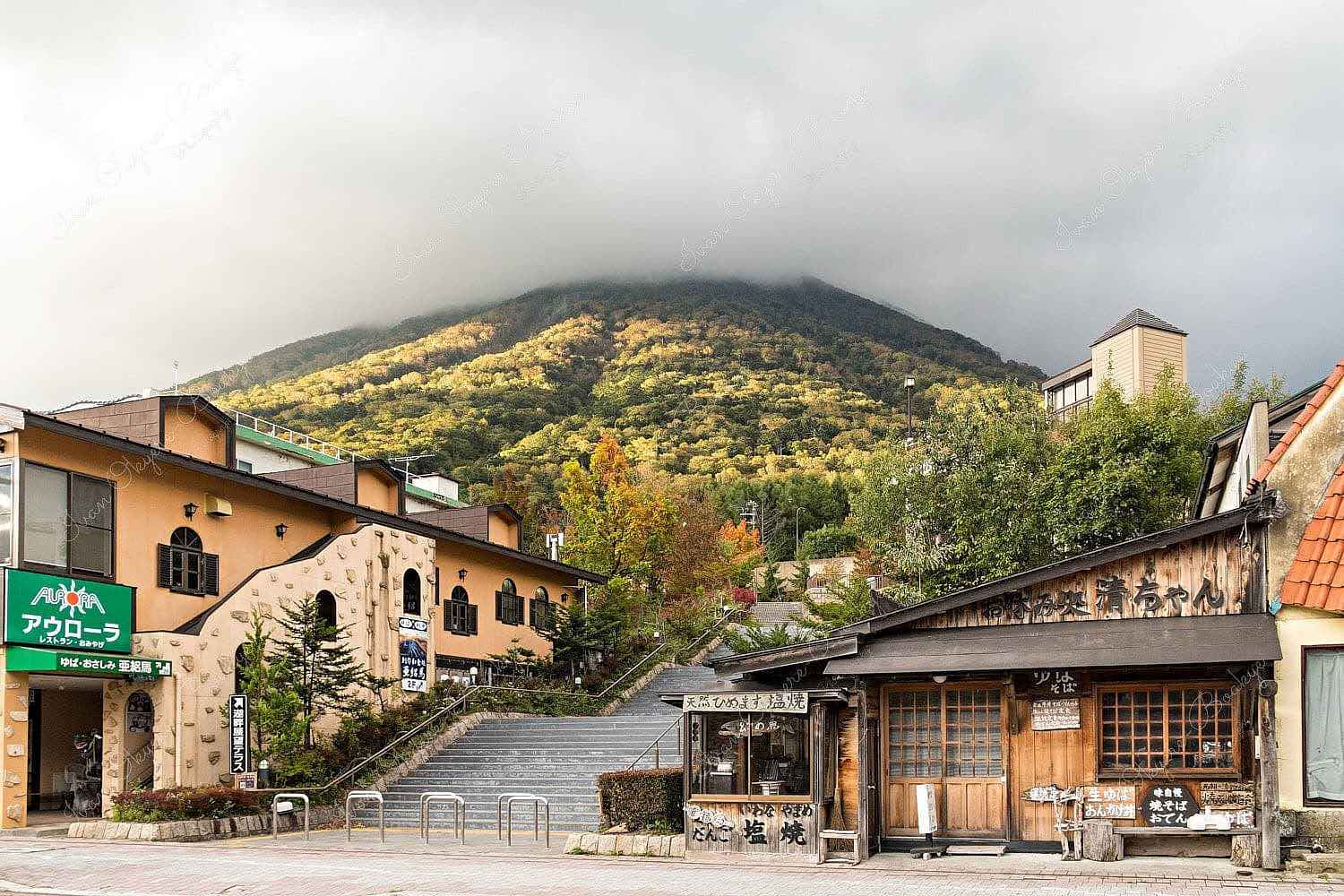 Autumn Fall Trees on the mountains towering over Chuzenjiko Onsen Town in Nikko, Japan