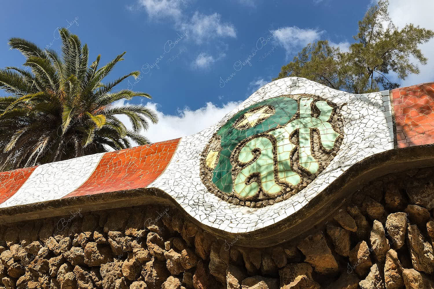 Tile shard mosaic design of the outside wall of Park Güell, Barcelona, Spain