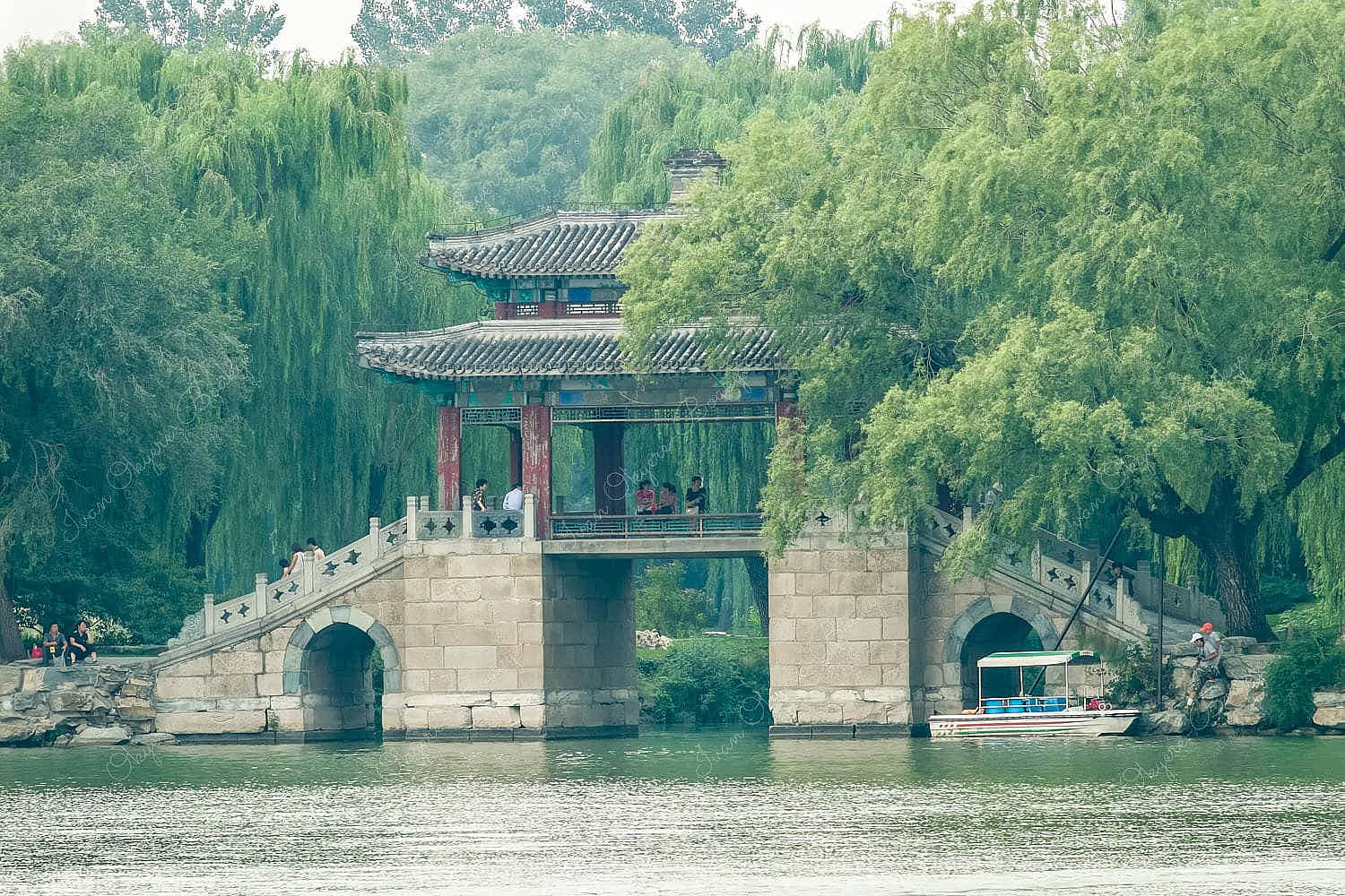 Bridge of Pastoral Poems surrounded by weeping willows at Kunming Lake, Beijing, China