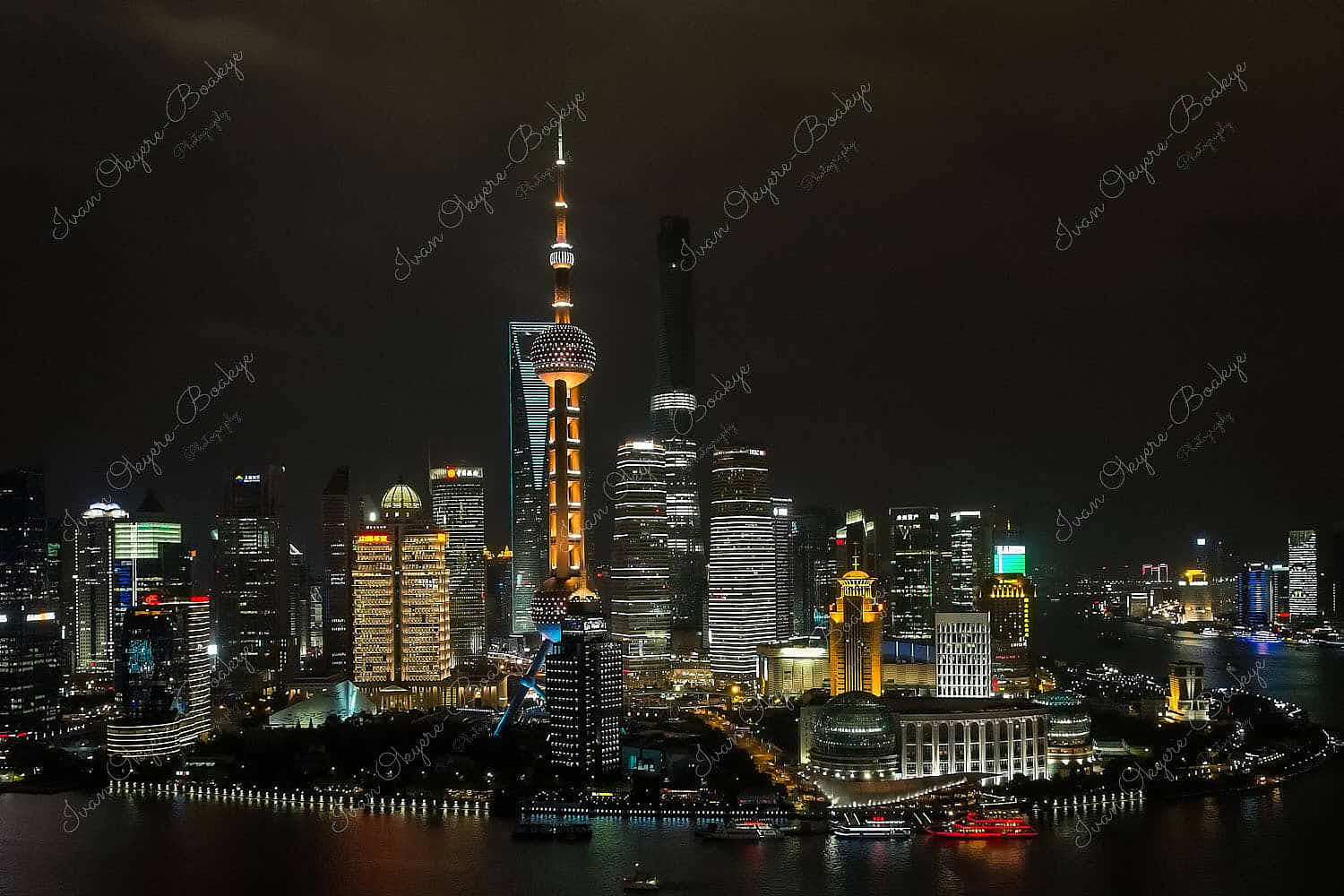 Jin Mao Tower, Shanghai Tower, Shanghai World Financial Center and the Oriental Pearl TV Tower; illuminated at night, Shanghai, China