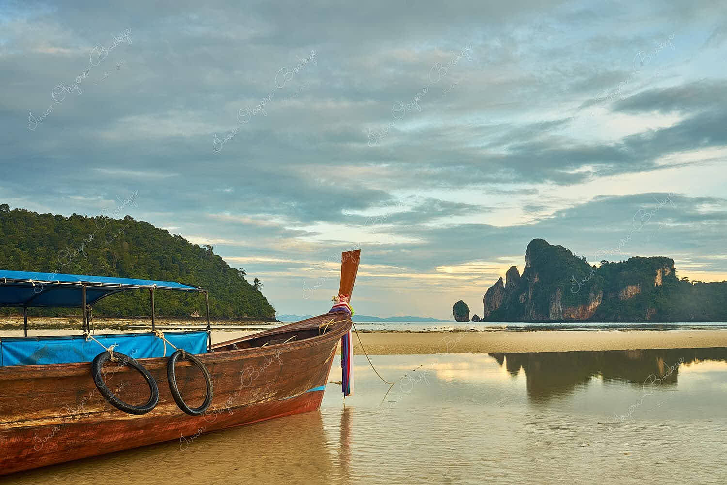 Moored longtail boat at low tide on Ko Phi Phi Don Beach, Ko Phi Phi, Thailand
