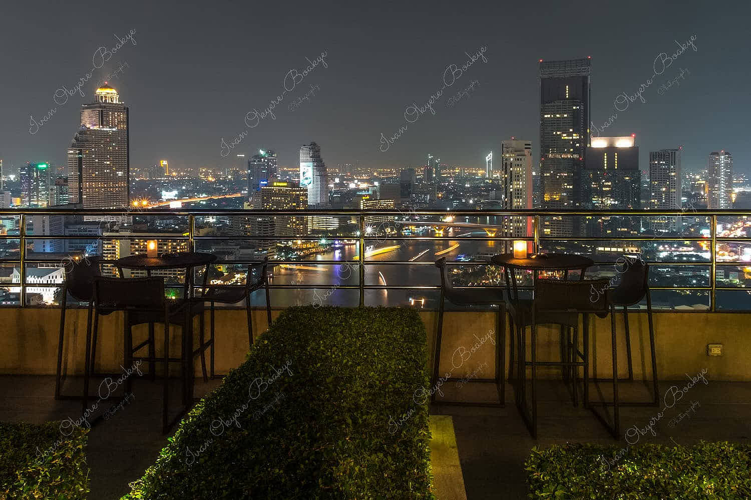 The amazing panoramic cityscape view of Bangkok at night from the outdoor terrace of the Millennium Hilton Bangkok Rooftop bar, Bangkok, Thailand