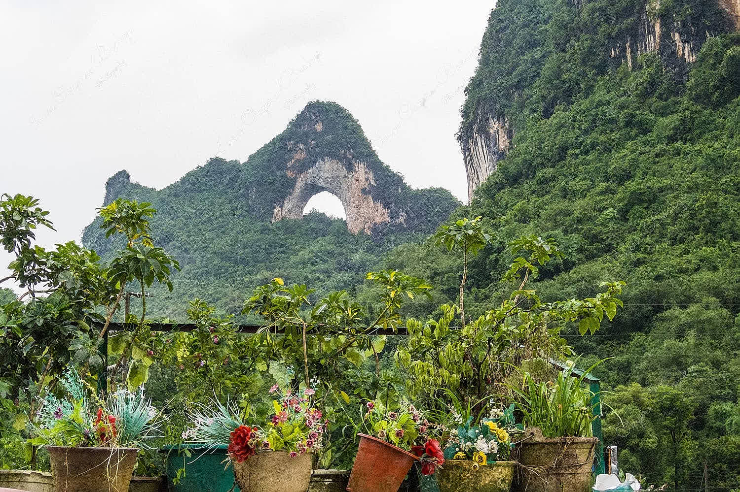 The famous arched Moon Hill in the karst landscape of Yangshuo, Guilin, China