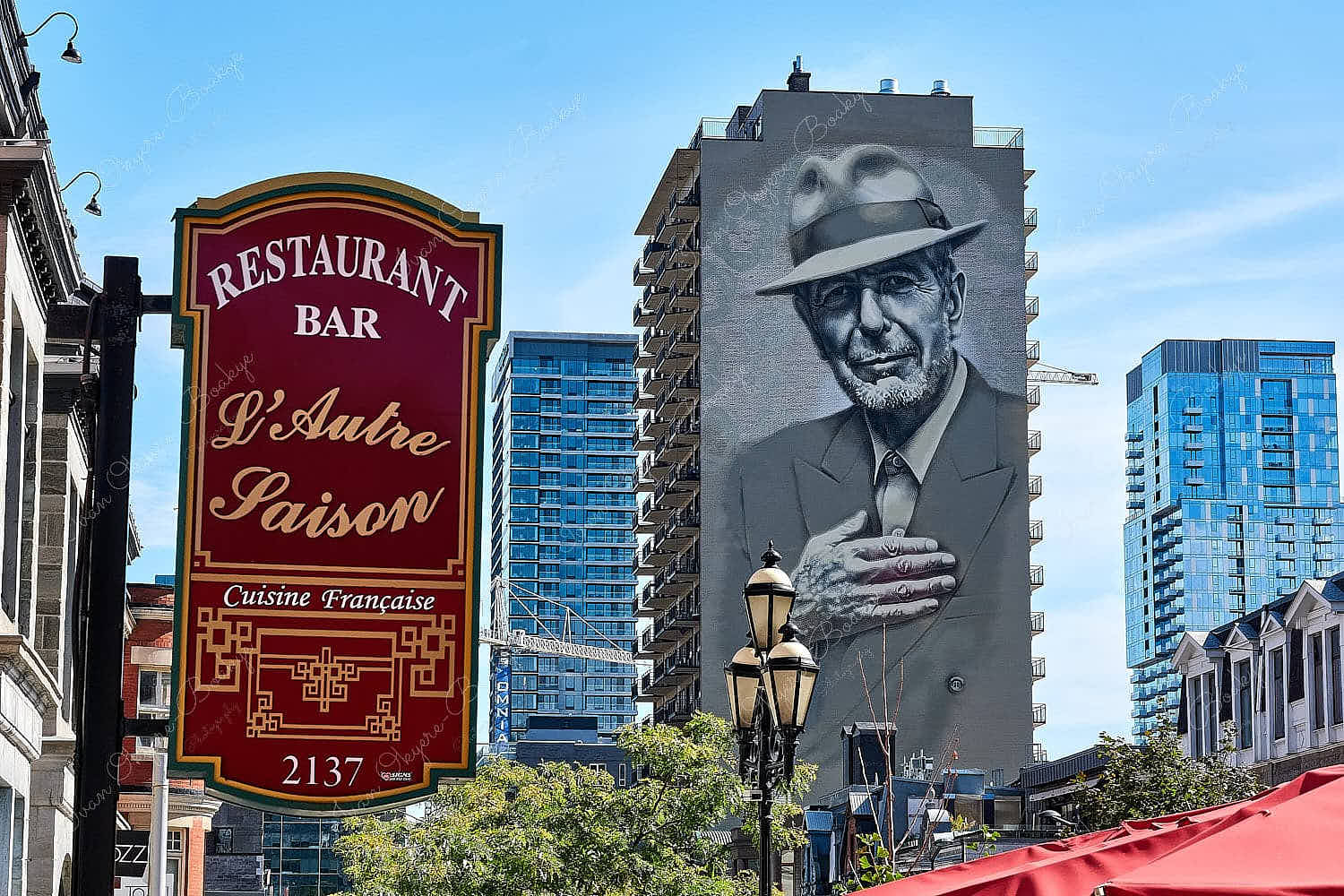 The giant mural of Leonard Cohen painted on a residential building in downtown Montreal, Quebec, Canada