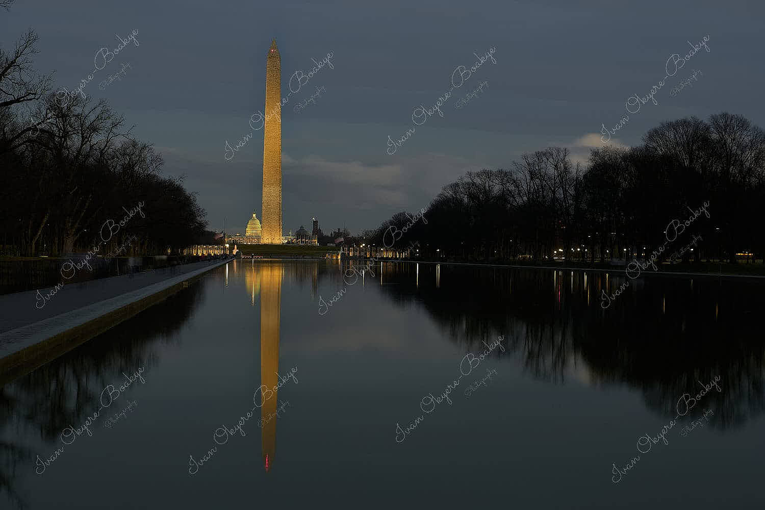 Sunset view of Washington Monument and Capitol building reflections in the Lincoln Memorial Reflecting Pool, Washington, America