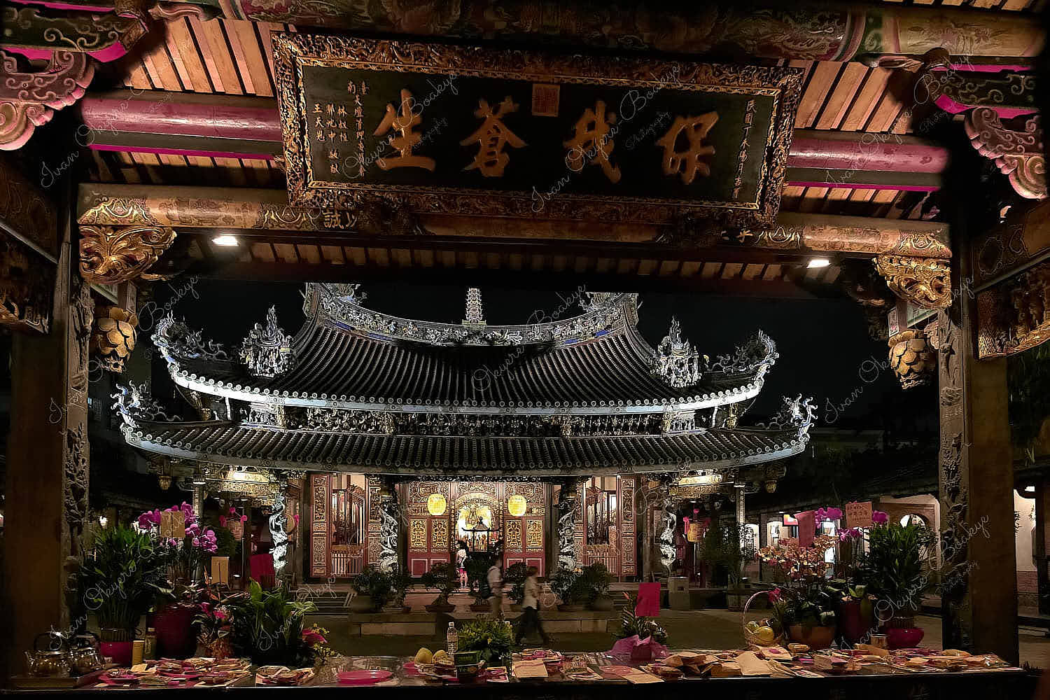 Table of offerings in Dalongdong Baoan Temple at night, Taipei, Taiwan