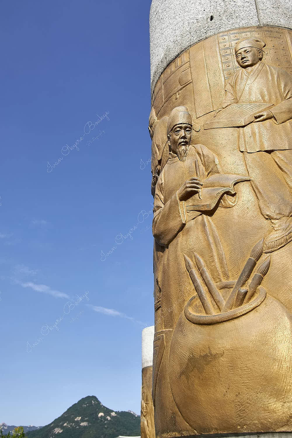 Engraved gold plated carvings on columns in Gwanghwamun Square, Seoul, South Korea