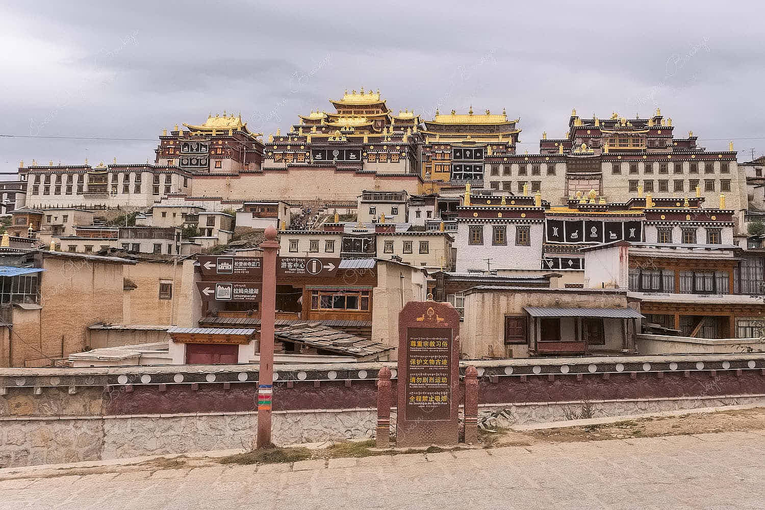 Scenic view of the main halls of the Songzanlin monastery with elaborate gold-plated roof tops in Shangri-La, Yunnan, China