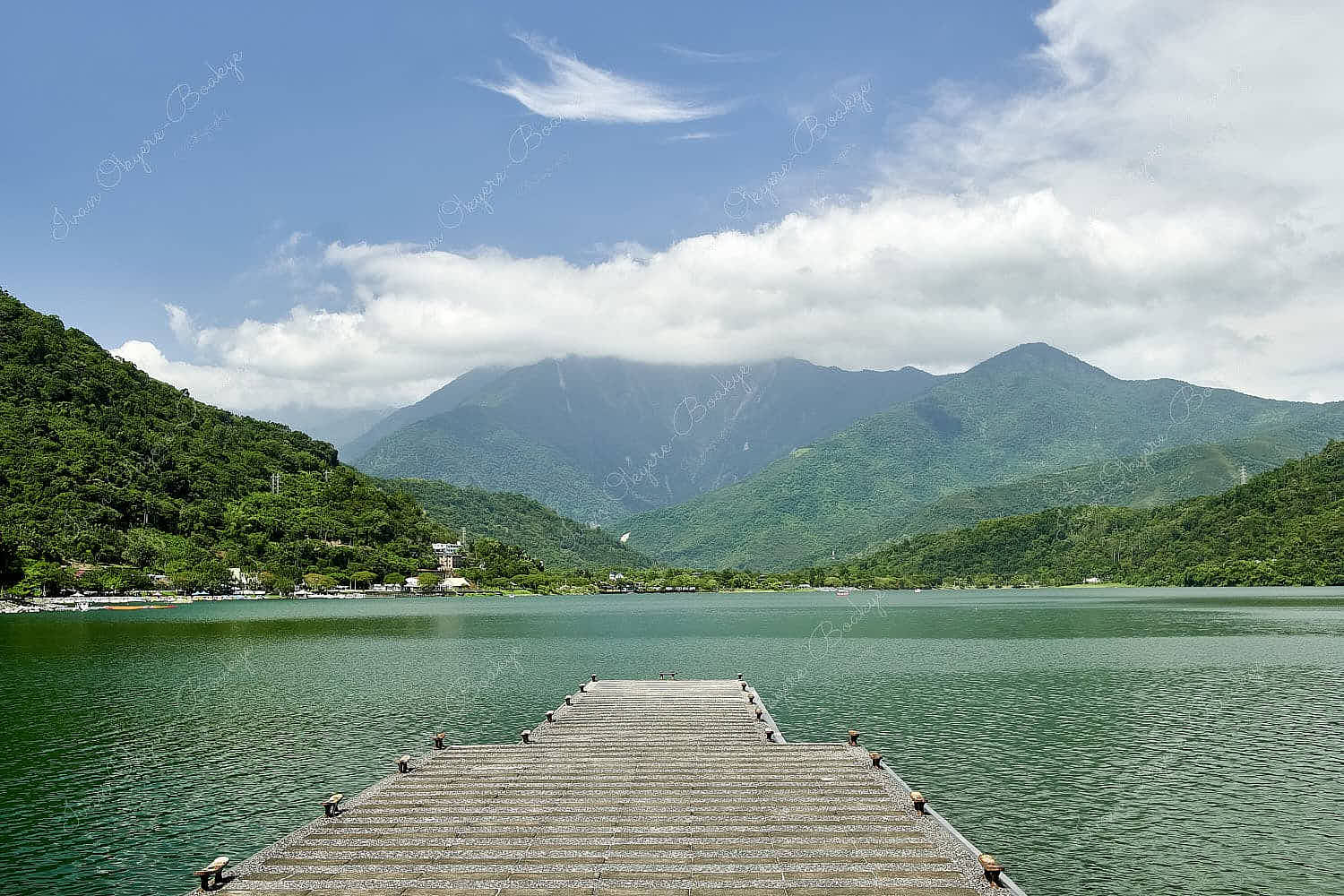 Empty pier leading towards the view of the lake and mountains at Carp Lake, Taiwan